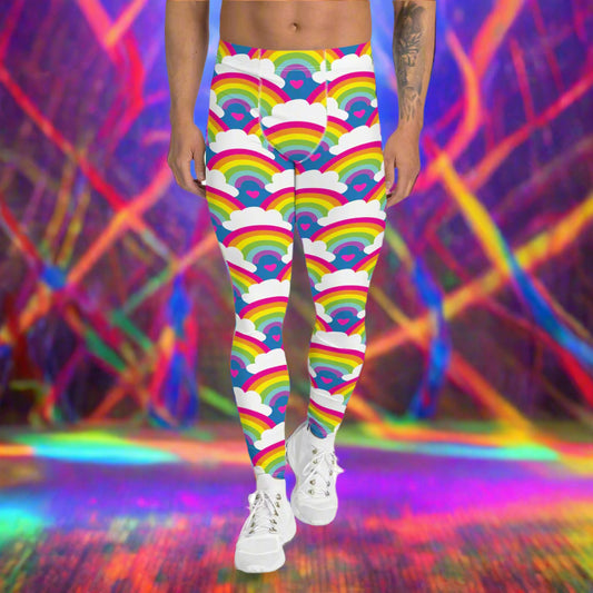 Man from the waist down wearing men's Rainbow Love funky festival yoga leggings standing facing forwards with his hands by his sides. The man is standing on a colour splashed dance floor with colourful light streams criss crossing behind him in reds, yellows, greens and blues. The rainbow love pattern features repeating rainbows and white fluffy clouds with a small pink heart beneath each rainbow. The background colour is royal sky blue