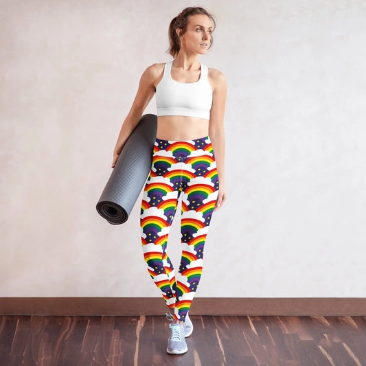 High waist Pride Rainbow Sparkle festival yoga leggings lifestyle view. The woman is standing in an indoor setting. The Rainbow Sparkle design is a bold rainbow, clouds and stars pattern in the LGBTQ+ pride palette. Designed in Wales, UK | Sassy Seagull.