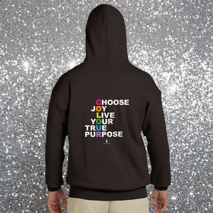 Person wearing a black Choose Joy hoodie facing away in a colourful boho cafe.