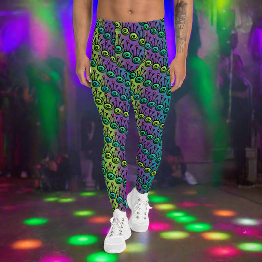 Man from the waist down wearing men's jungle tribal frog funky festival yoga leggings standing facing forwards with his hands by his sides. He is wearing white trainers and is standing on a nightclub dance floor with colourful neon light spots around him. The jungle tribal frog pattern  is an abstract pattern with a blended green and purple background.