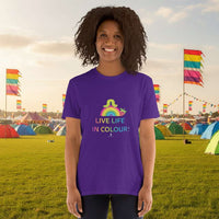 Woman wearing a purple 100% cotton vibrant, rainbow live life in colour t-shirt in a bohemian yurt interior decorated with fairy lights, rugs, candles and plants.