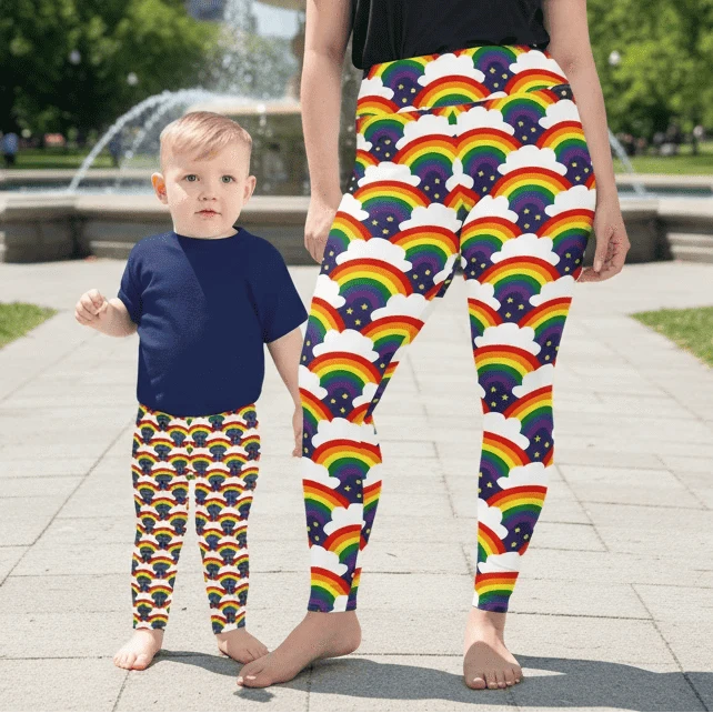 Woman and toddler wearing matching rainbow sparkle all over print patterned festival leggings - designed in Wales | Sassy Seagull