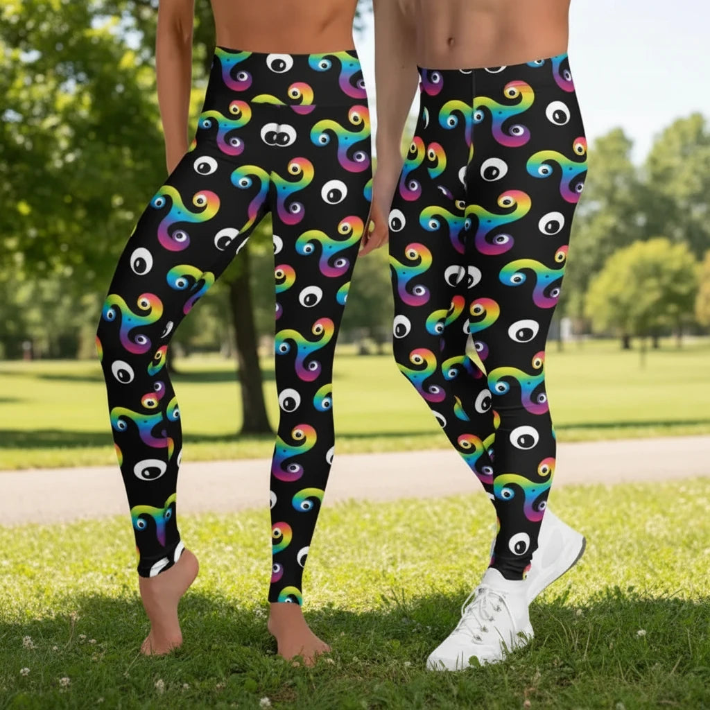 Man and woman wearing matching black psychedelic celtic inspired Trippy Triskelion patterned festival & yoga leggings in front of a silver sequin background. The Trippy Triskelion print is a trippy rainbow geometric printed pattern. Designed in Wales, UK | Sassy Seagull. 