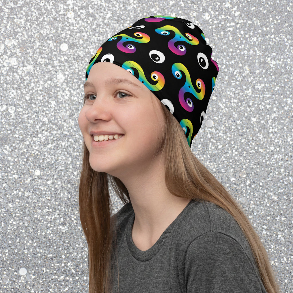 Young woman wearing a Trippy Triskelion neck gaiter as a beanie hat at a fireworks display