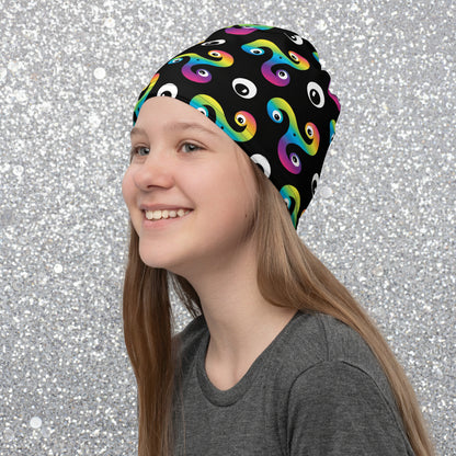 Young woman wearing a Trippy Triskelion neck gaiter as a beanie hat at a fireworks display