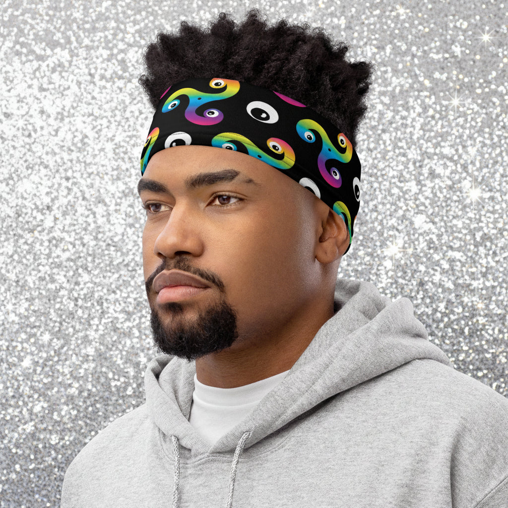Man wearing a Trippy Triskelion neck gaiter as a headband at a skate park.
