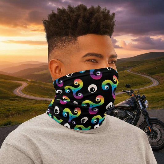Man wearing a Trippy Triskelion neck gaiter as a face covering, facing to the right outside a biker cafe