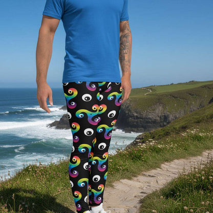Man from the waist down wearing Trippy Triskelion leggings facing to the right in a nightclub environment with purple and green lights