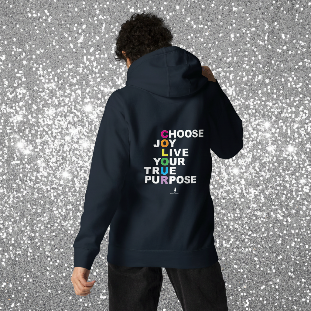 Woman facing away wearing a navy hoodie with 'Choose Joy. Live Your True Purpose' on the back. She is standing in a cosy boho cafe filled with plants and wooden tables.