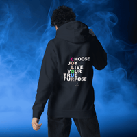 Woman facing away wearing a navy hoodie with 'Choose Joy. Live Your True Purpose' on the back. She is standing in a cosy boho cafe filled with plants and wooden tables.