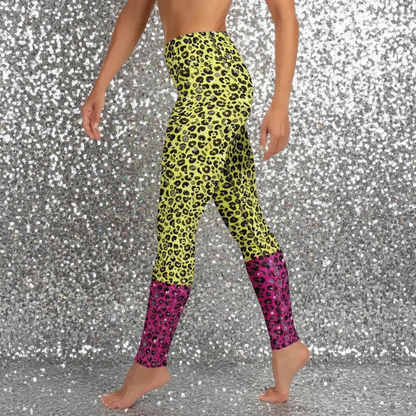 High waist Pink and Yellow Leopard Glamour festival yoga leggings side view against a teal background. The pink and yellow leopard glamour design is a bold animal printed pattern in black, grey and white against a bold yellow and pink background. Designed in Wales, UK | Sassy Seagull. 