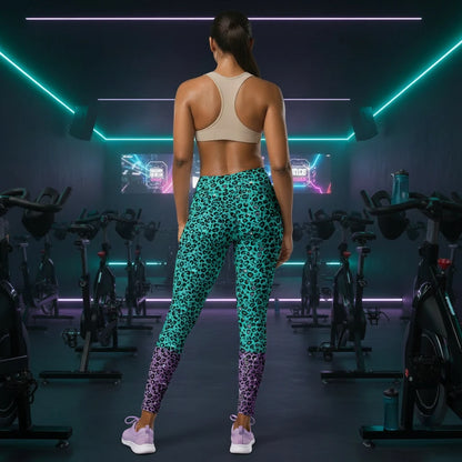 High waist Purple and Green Leopard Glamour festival yoga leggings back view against a silver sequin background. The purple and green leopard glamour design is a bold animal printed pattern in black, grey and white against a bold purple and green background. Designed in Wales, UK | Sassy Seagull. 