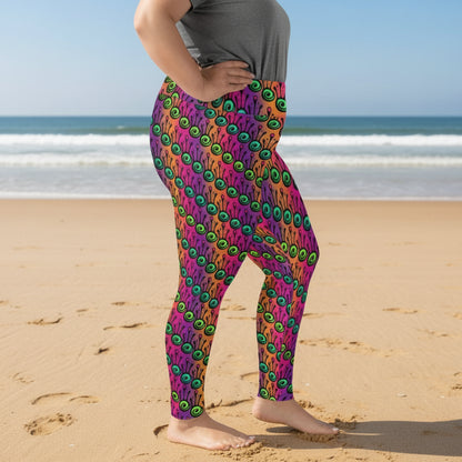 High waist Plus Size Fire Tribal Frog festival yoga leggings side view. Woman is standing in a. boho interior room.  The Tribal Frog design is a bold colourful abstract print on a blended pink, purple and orange background. Designed in Wales, UK | Sassy Seagull. 