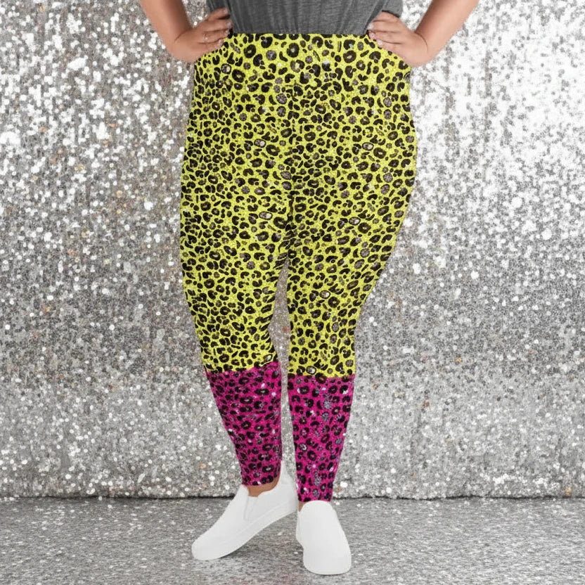 High waist plus size Pink and Yellow Leopard Glamour festival yoga leggings front view against a rustic boho background with bunting, plants and fairy lights. The pink and yellow leopard glamour design is a bold animal printed pattern in black, grey and white against a bold yellow and pink background. Designed in Wales, UK | Sassy Seagull. 