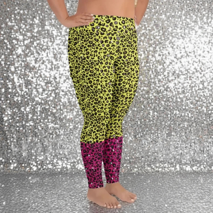 High waist plus size Pink and Yellow Leopard Glamour festival yoga leggings side view against a rustic boho background with bunting, plants and fairy lights. The pink and yellow leopard glamour design is a bold animal printed pattern in black, grey and white against a bold yellow and pink background. Designed in Wales, UK | Sassy Seagull. 