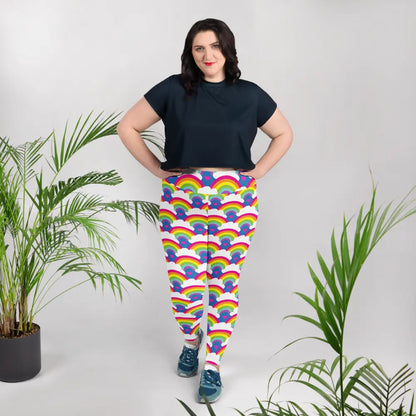 High waist Rainbow Love festival yoga leggings lifestyle view. The woman is standing in an indoor setting.  The Rainbow Love design is a bold design featuring rainbows, white clouds and pink hearts. Designed in Wales, UK | Sassy Seagull. 