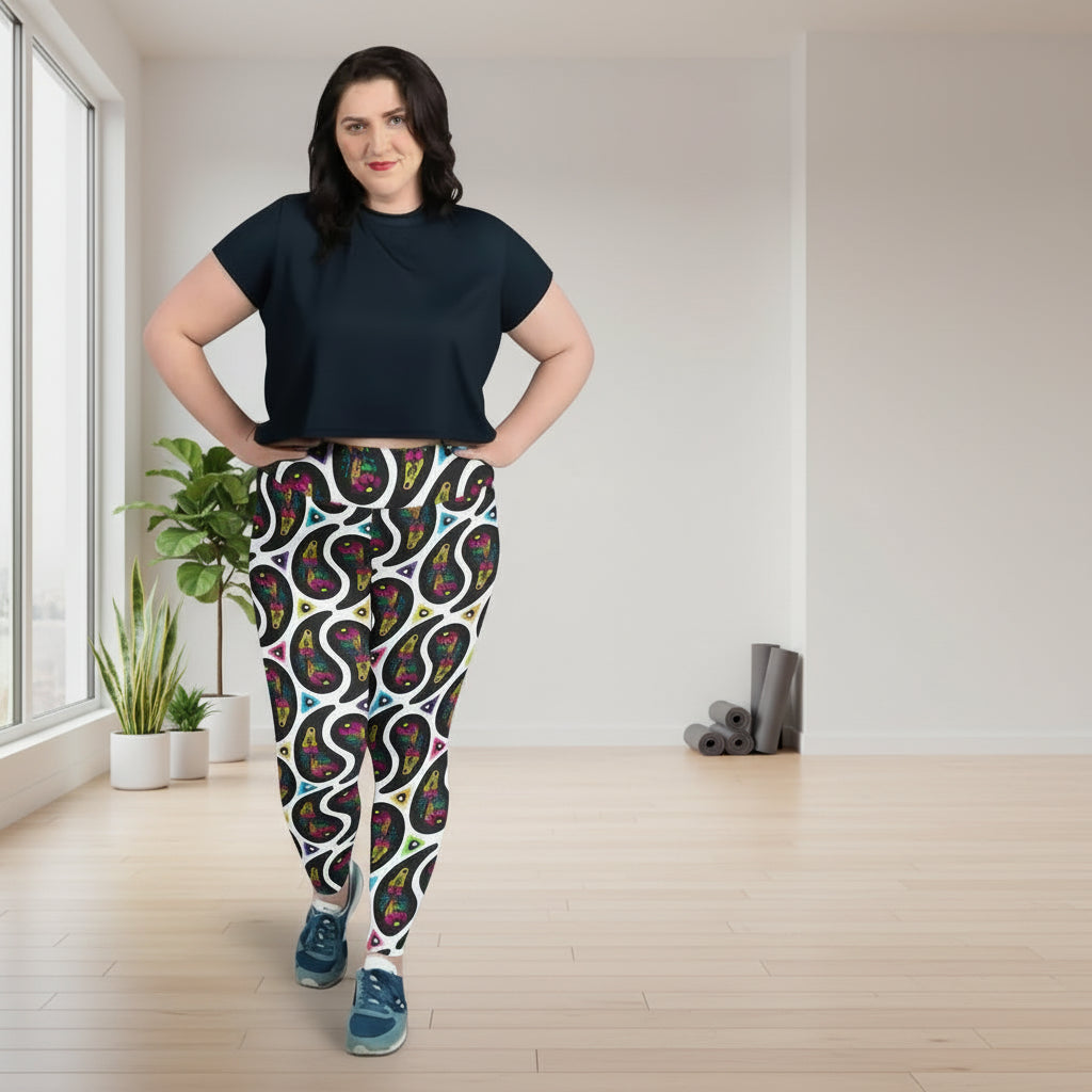 High waist Plus Size White Paisley Party festival yoga leggings lifestyle view. Woman is standing in a boho interior room.  The Paisley Party design is a bold colourful rainbow geometric print pattern. Designed in Wales, UK | Sassy Seagull. 