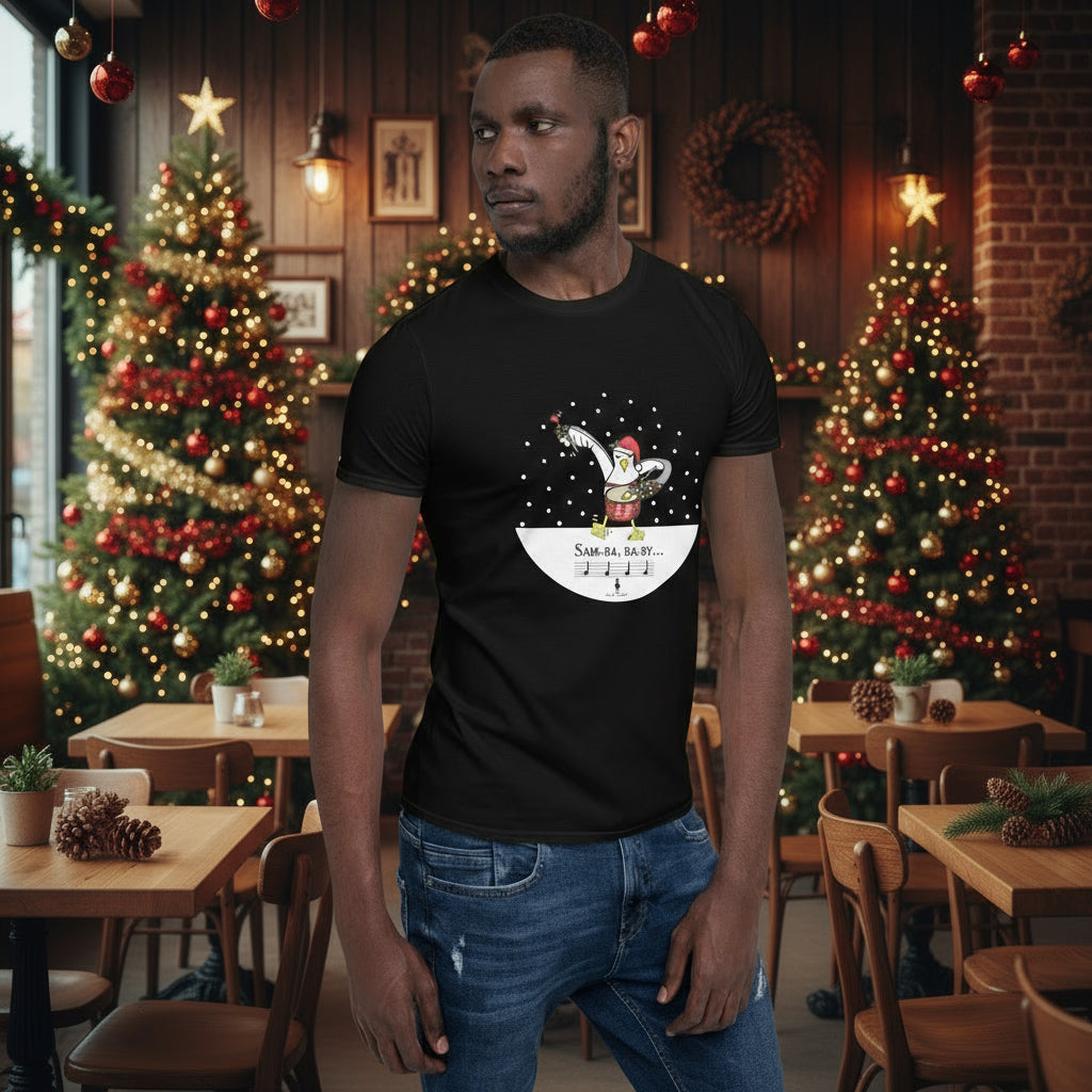 Man wearing a black 100% cotton samba drumming seagulll in the snow Christmas t-shirt with the text Samba Baby in a rustic cafe filled with red, green and gold Christmas decorations