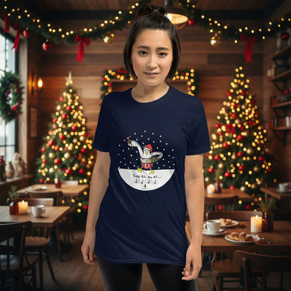Woman wearing a navy blue 100% cotton samba drumming seagulll in the snow Christmas t-shirt with the text Samba Baby in a rustic cafe filled with red, green and gold Christmas decorations