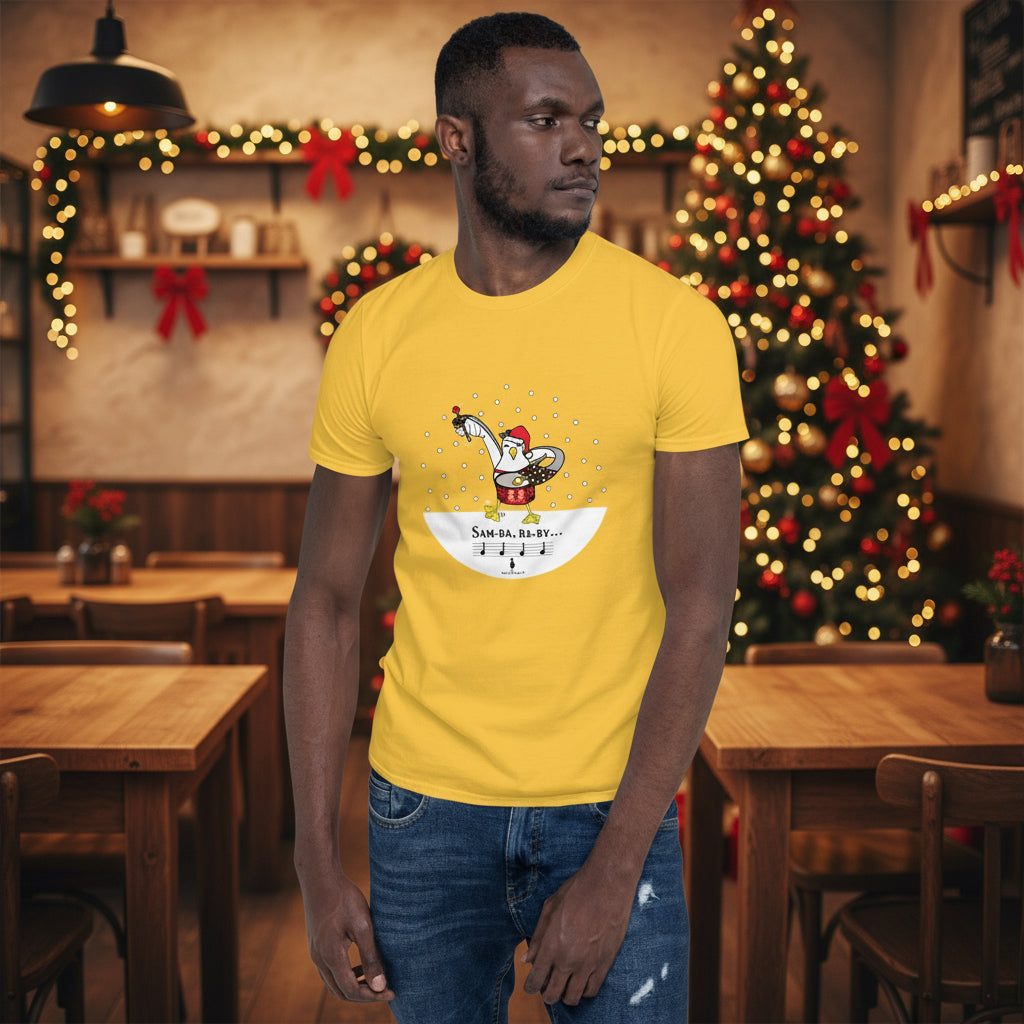 Man wearing a yellow 100% cotton samba drumming seagulll in the snow Christmas t-shirt with the text Samba Baby in a rustic cafe filled with red, green and gold Christmas decorations