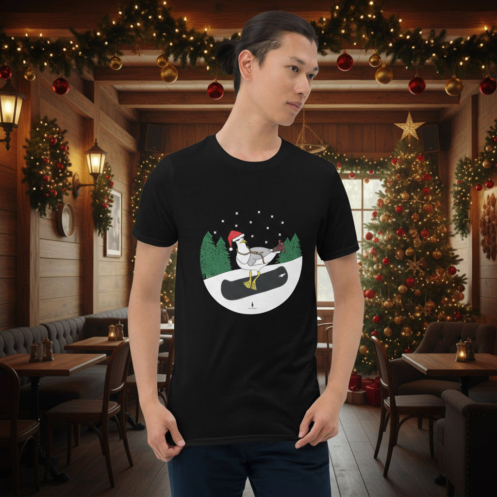Man wearing a black 100% cotton snowboarding seagull Christmas t-shirt, in a rustic cafe filled with red, green and gold Christmas decorations