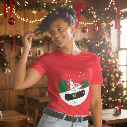 Woman wearing a red 100% cotton snowboarding seagull Christmas t-shirt, in a rustic cafe filled with red, green and gold Christmas decorations